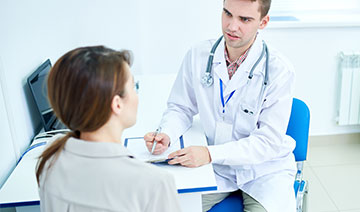 A doctor having an inteview with the patient.